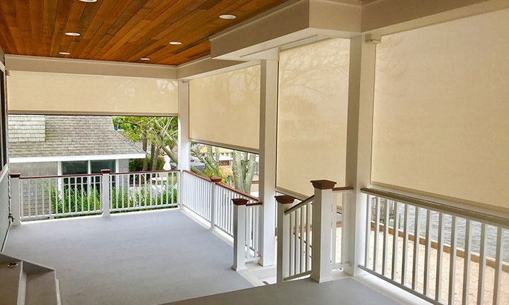 Raised deck, completely screened-in with retractable screens. 