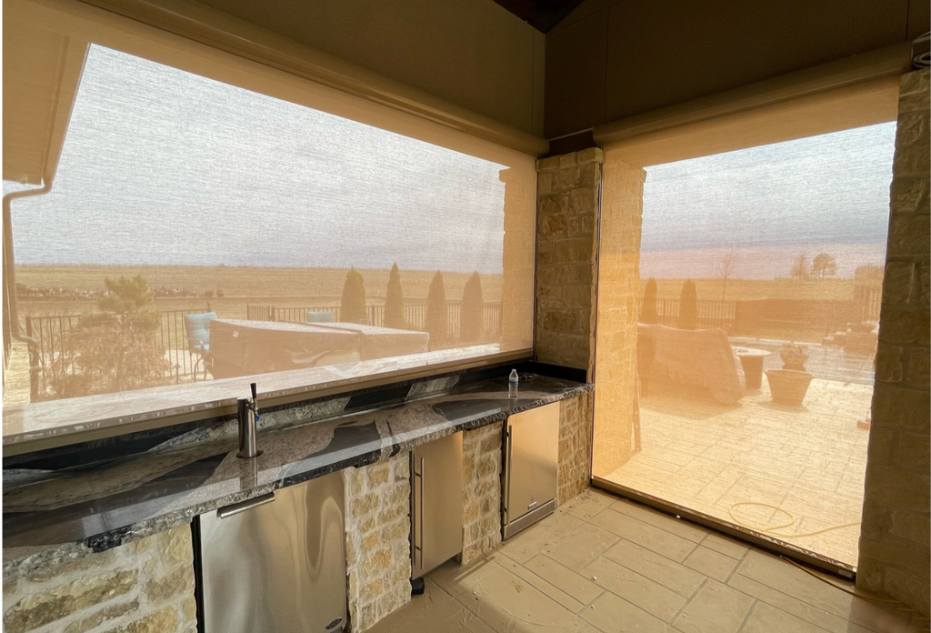 A completely screened-in outdoor kitchen area, ready for a day of fall outdoor entertainment.
